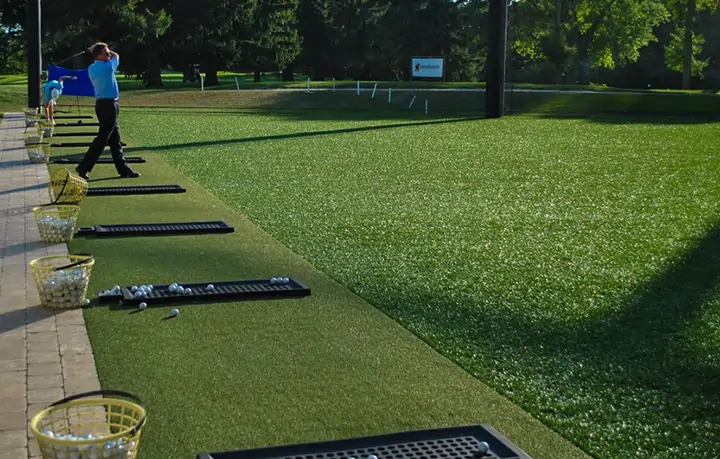 Golfer teeing off on artificial grass from SYNLawn